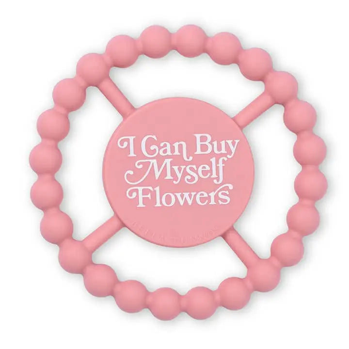 Pink beaded ring with 'I Can Buy Myself Flowers' text on a white background