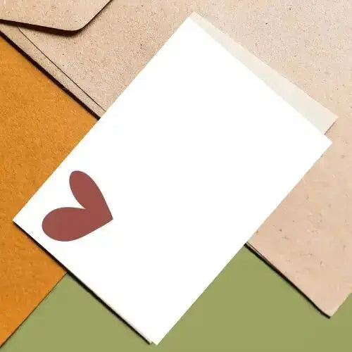 White card with a red heart on a colorful background