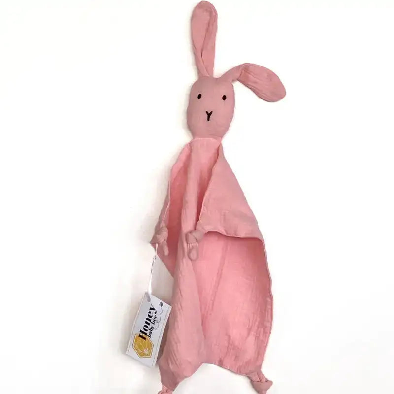 Pink bunny plush toy with a tag on a white background