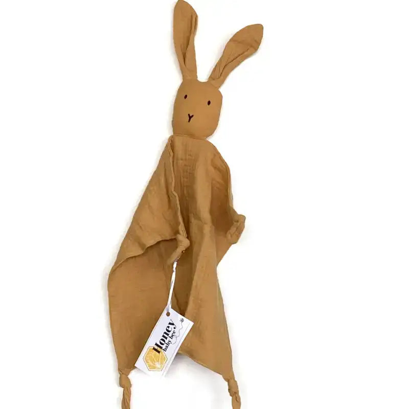 Brown rabbit-shaped plush toy with a tag on a white background