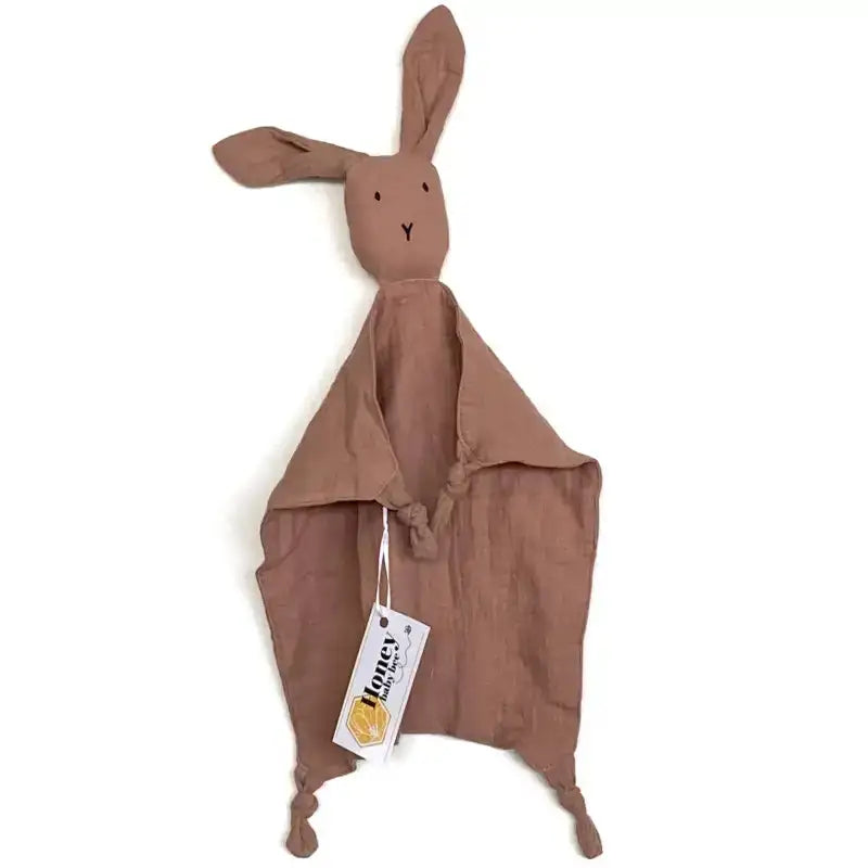 Brown rabbit-shaped comfort blanket with a tag on a white background