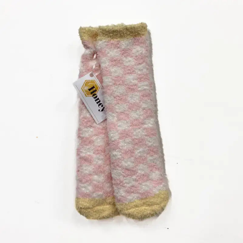 Pair of pink and gold patterned socks with a 'Honey' tag on a white background