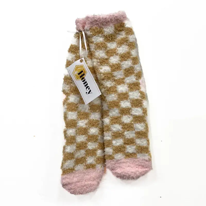 Checkered socks with pink accents on a white background, featuring a 'Honey' brand tag.