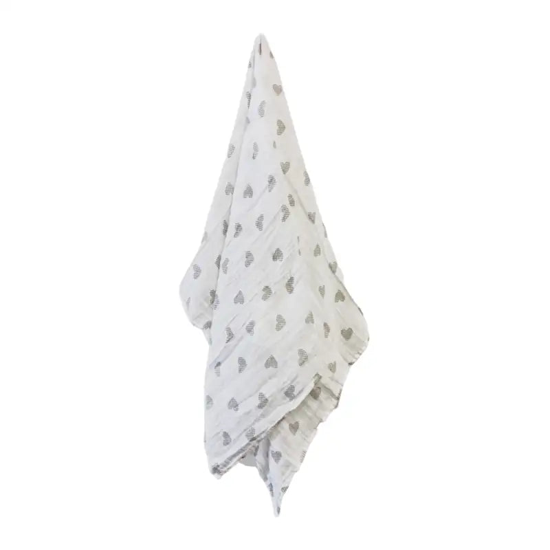 White towel with gray heart pattern on a white background