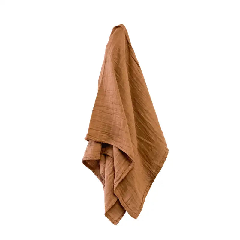 Brown textured blanket on a white background