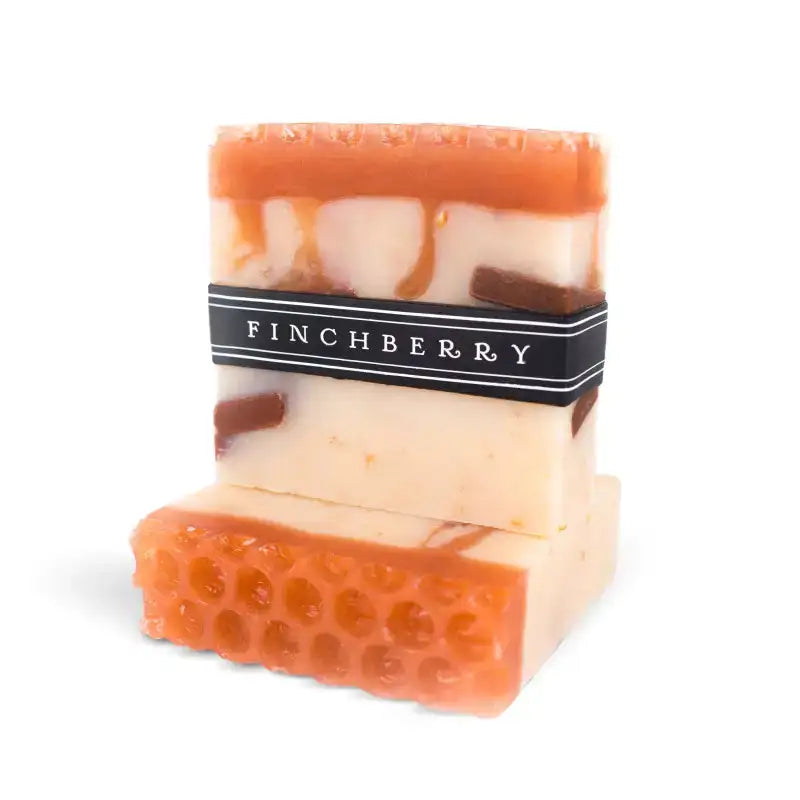 Bar of soap with a visible brand label on a white background