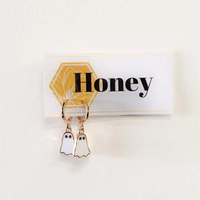 Ghost-shaped earrings on a card with 'Honey' text