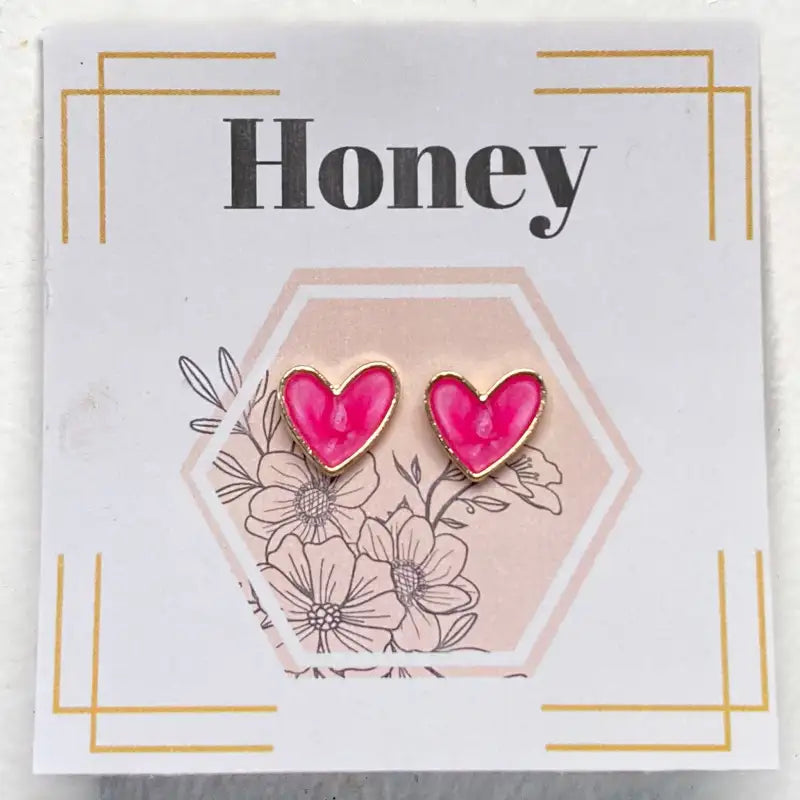 Heart-shaped earrings on a card with 'Honey' text and floral design