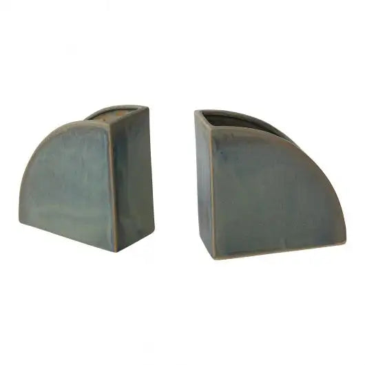 Two gray ceramic bookends on a white background
