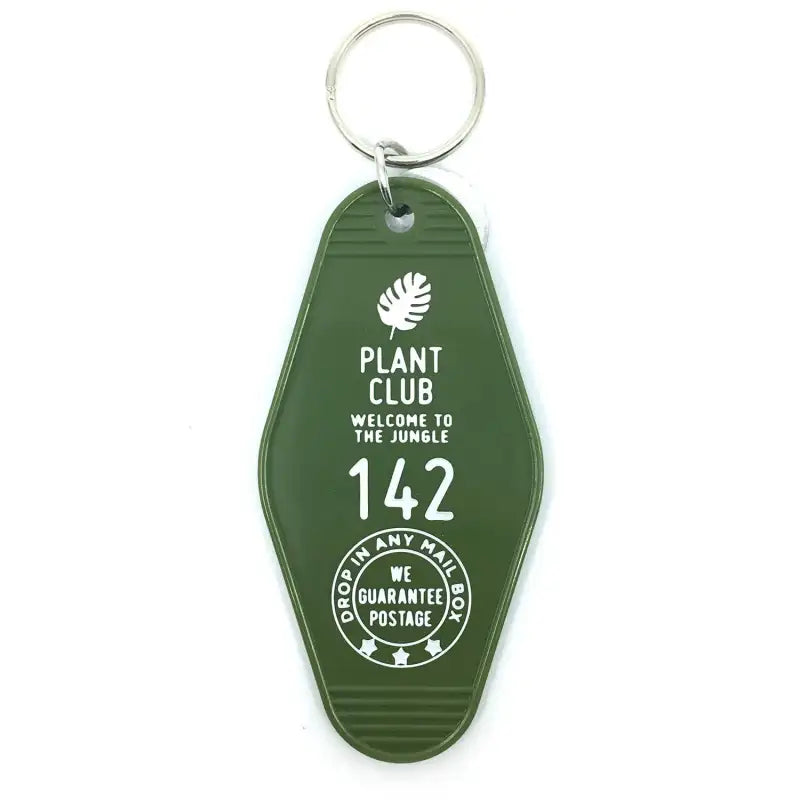 Green keychain with white text and design on a white background