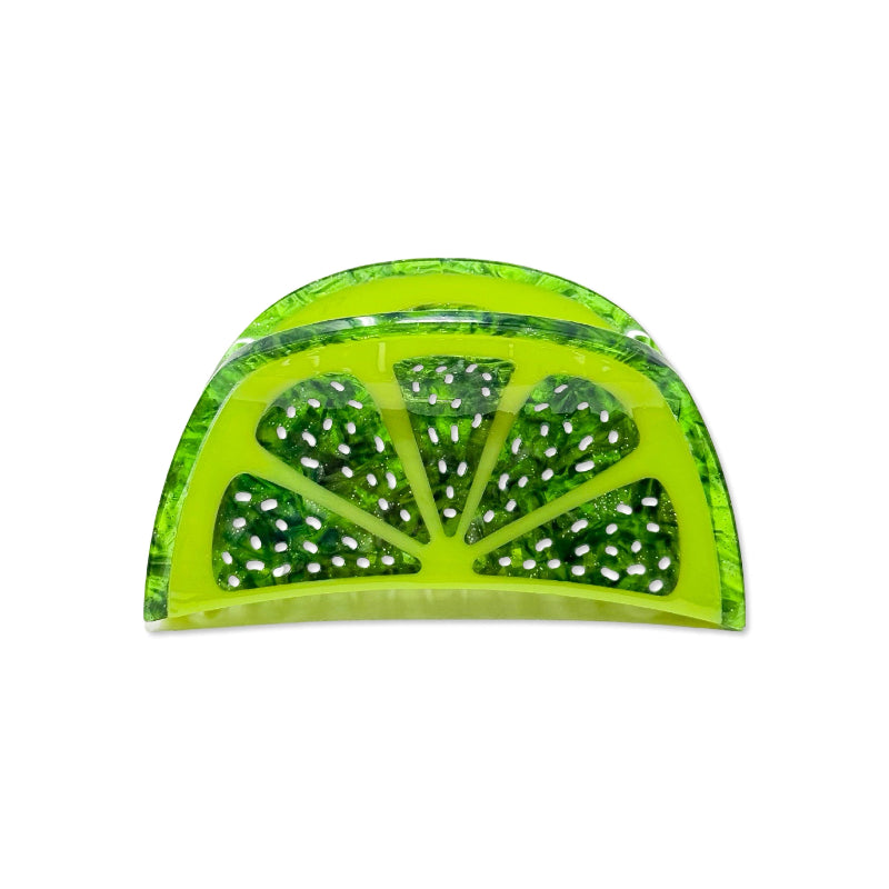 A translucent lime-green hair claw shaped like a sliced lime wedge, featuring white and green inclusions inside, set against a plain white background.