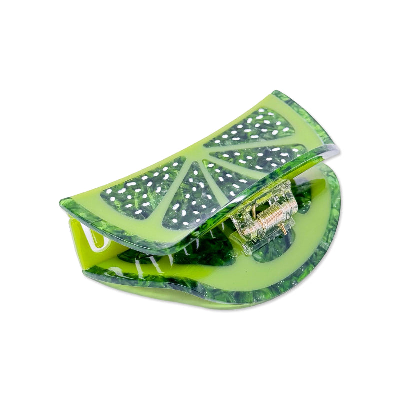 Large green lime hair claw clip on a white background