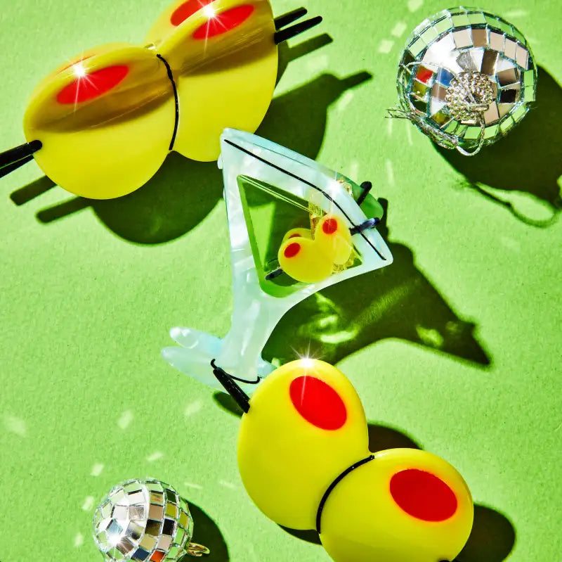 Large olive hair claw with red spots on a green background