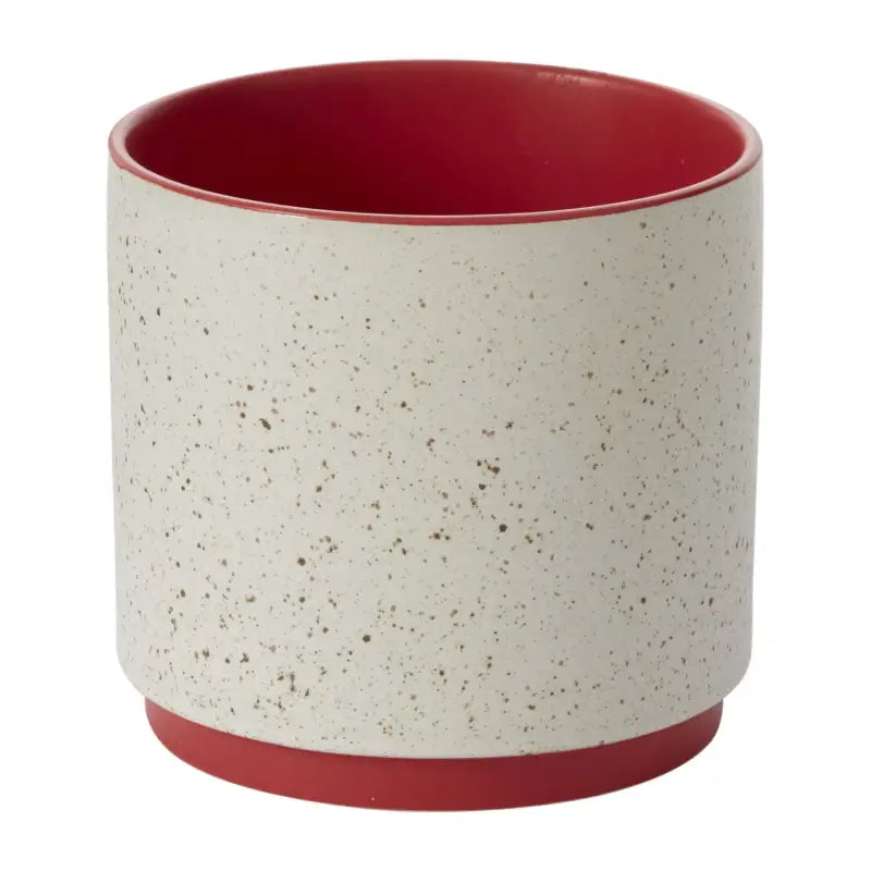 Ceramic cup with red interior and base on a white background