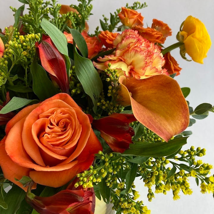 Live Like Luke Flower Arrangement with orange and yellow flowers
