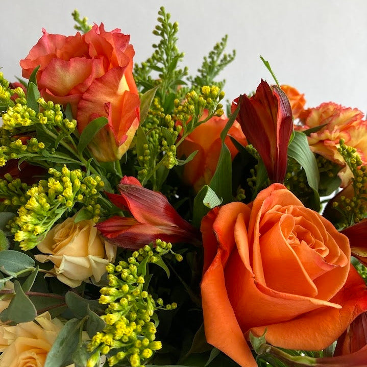 Live Like Luke Flower Arrangement with orange and yellow flowers