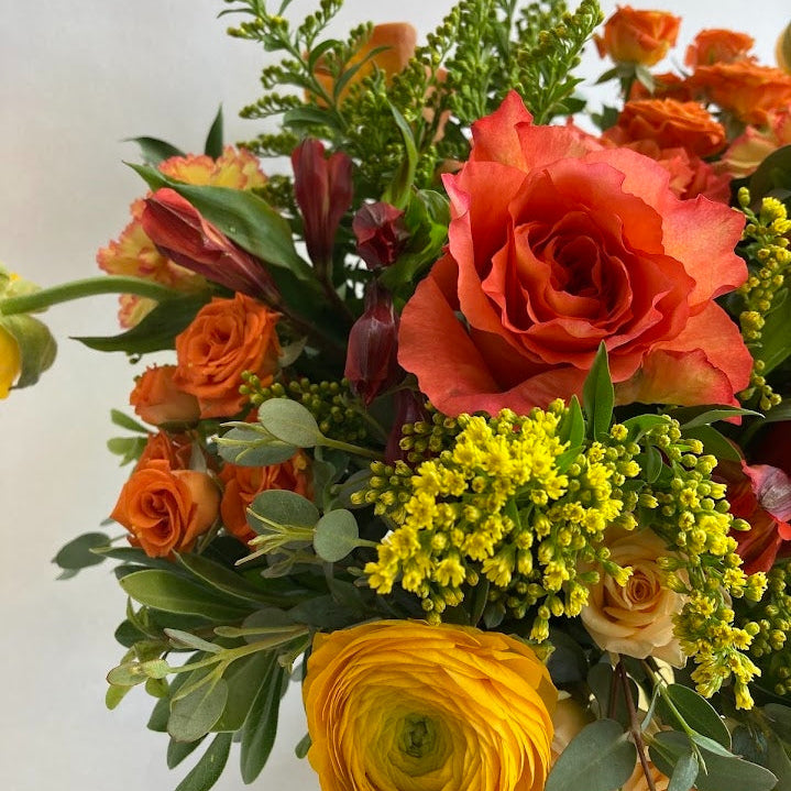Live Like Luke Flower Arrangement with orange and yellow flowers 