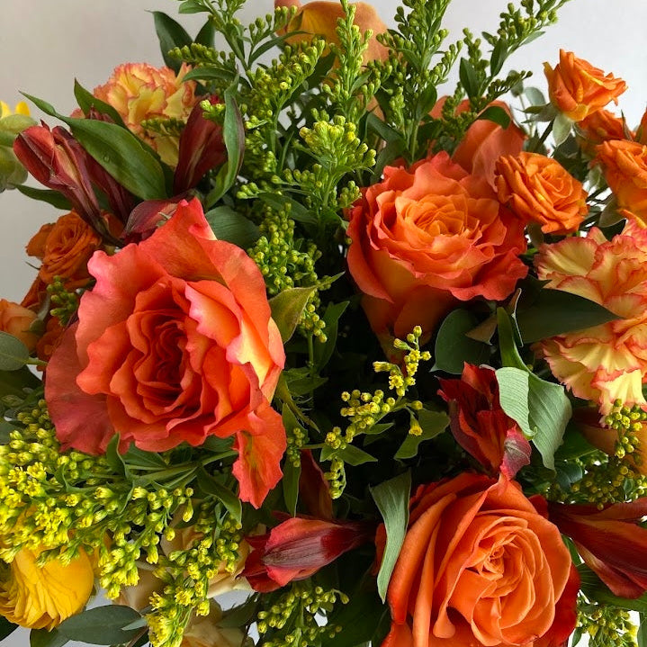 Live Like Luke Flower Arrangement with orange and yellow flowers