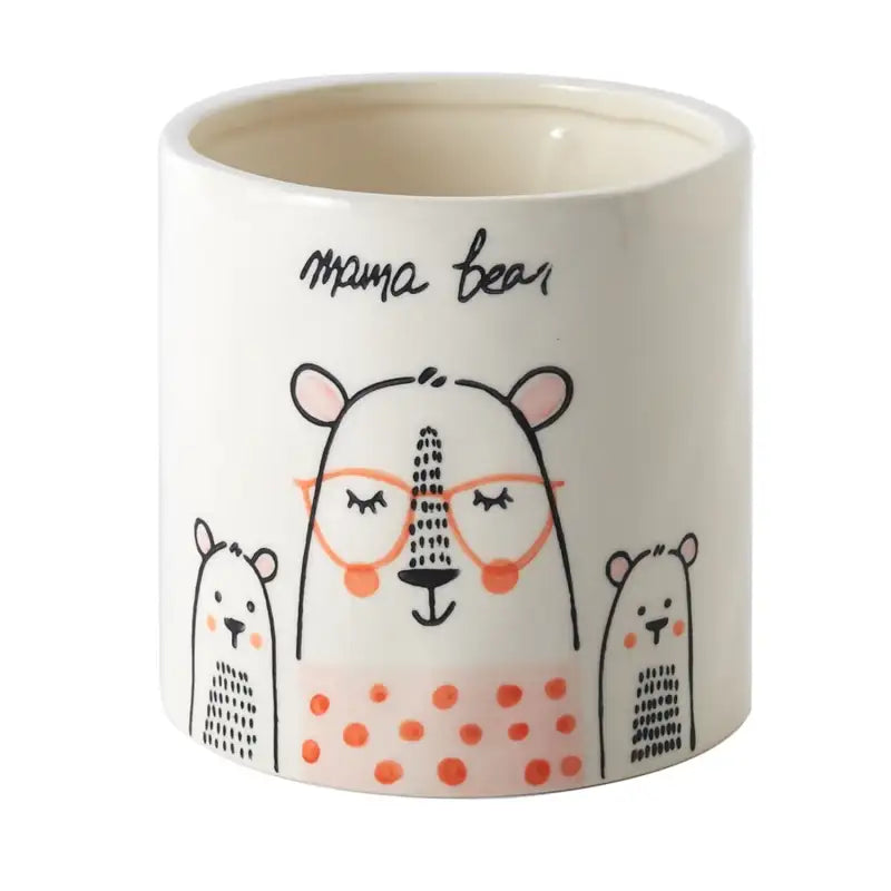 Ceramic mug with 'mama bear' design on a white background