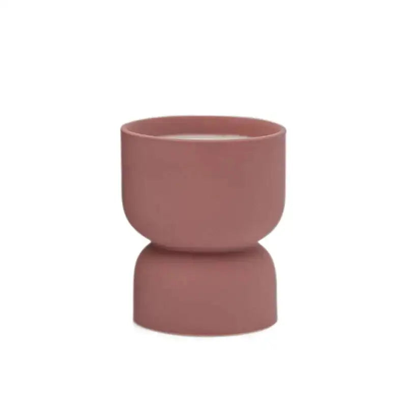 Pink ceramic planter on a white background