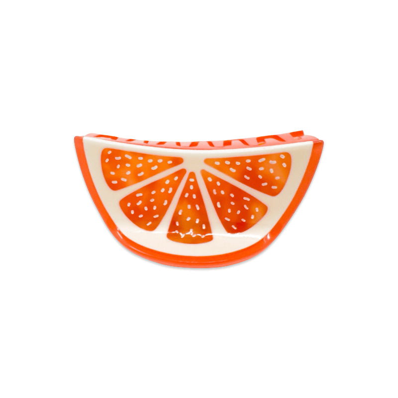 medium sized grapefruit slice hair claw clip on white background