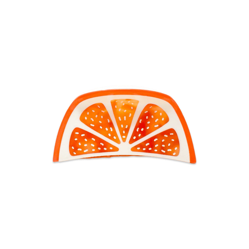 Grapefruit slice hair claw slip on a white background