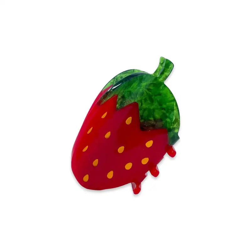 Red strawberry-shaped hair claw with green leaf on a white background