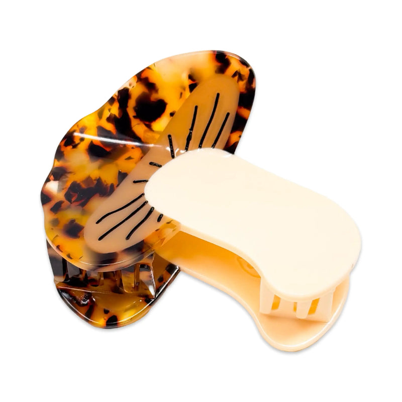 Tortoiseshell hair clip with a white sponge on a white background