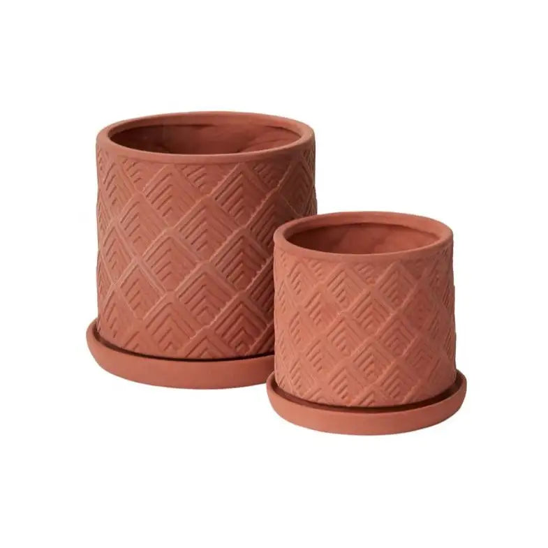 Two terracotta planters with diamond pattern on a white background