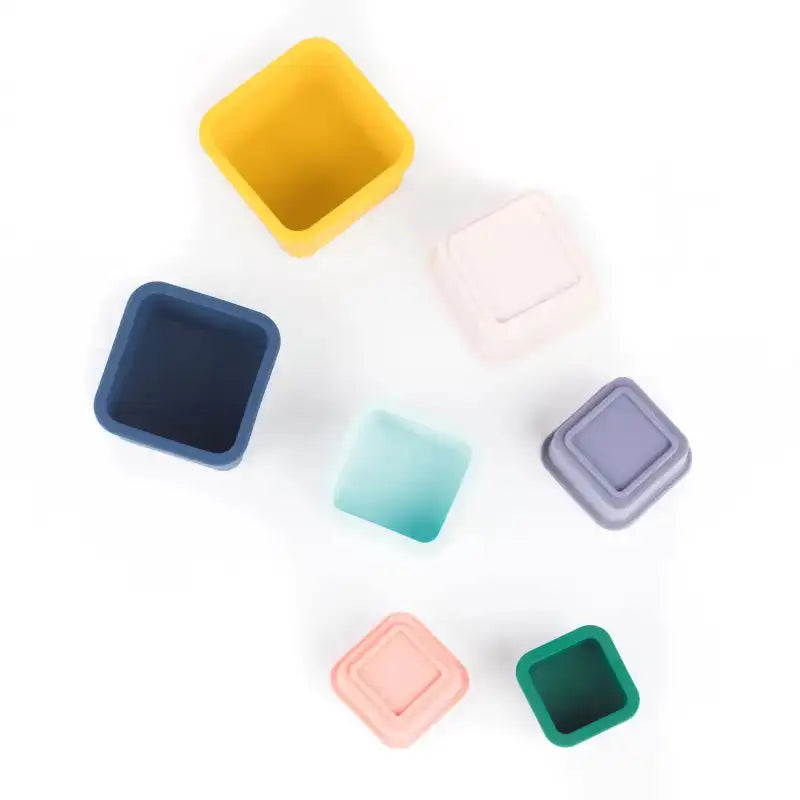 Set of colorful square containers on a white background