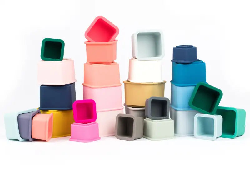 Colorful stackable containers on a white background