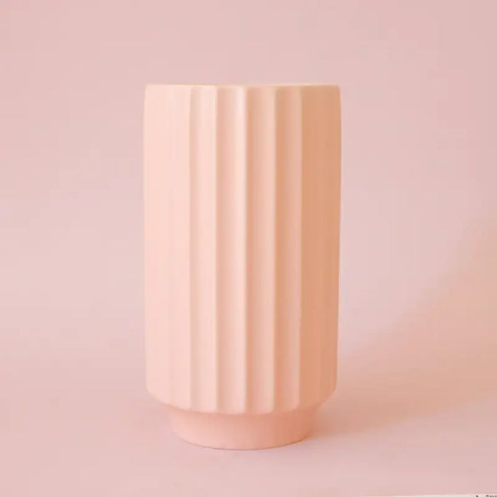 Petal pink-ribbed Monroe vase on a matching pink background