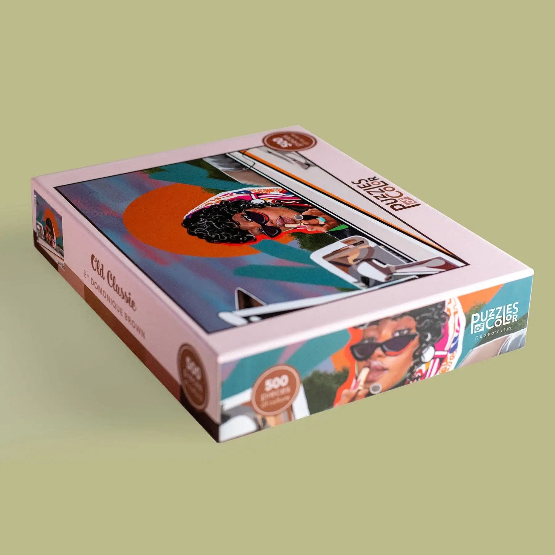 Jigsaw puzzle box with colorful design on a green background