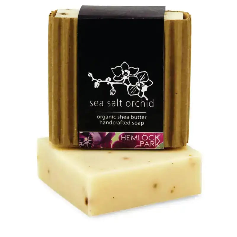 Bar of soap with a black label featuring floral design and 'Hemlock Park' branding on a white background.