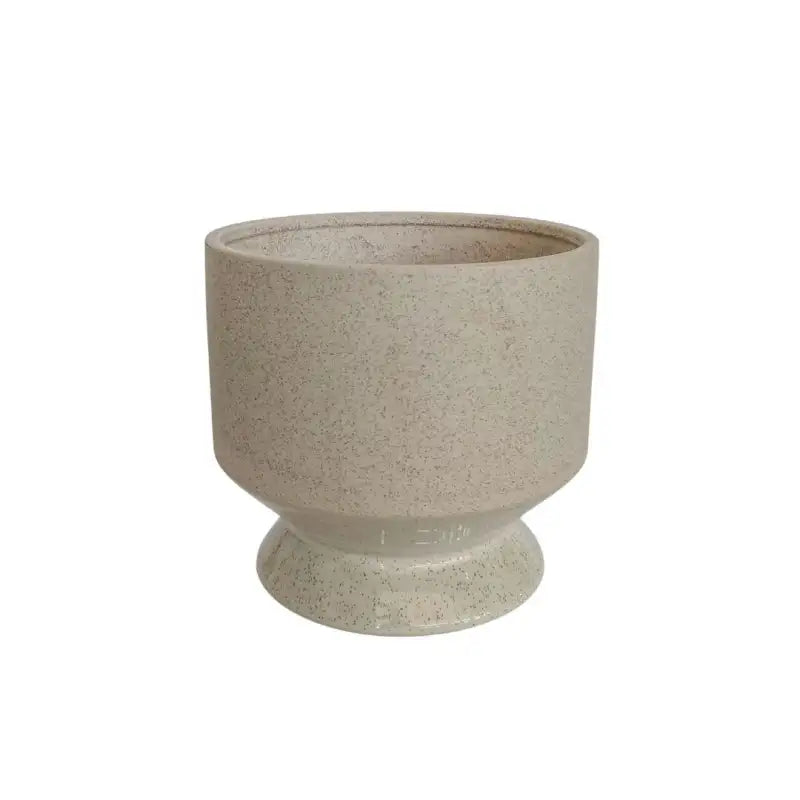 Beige ceramic planter on a white background