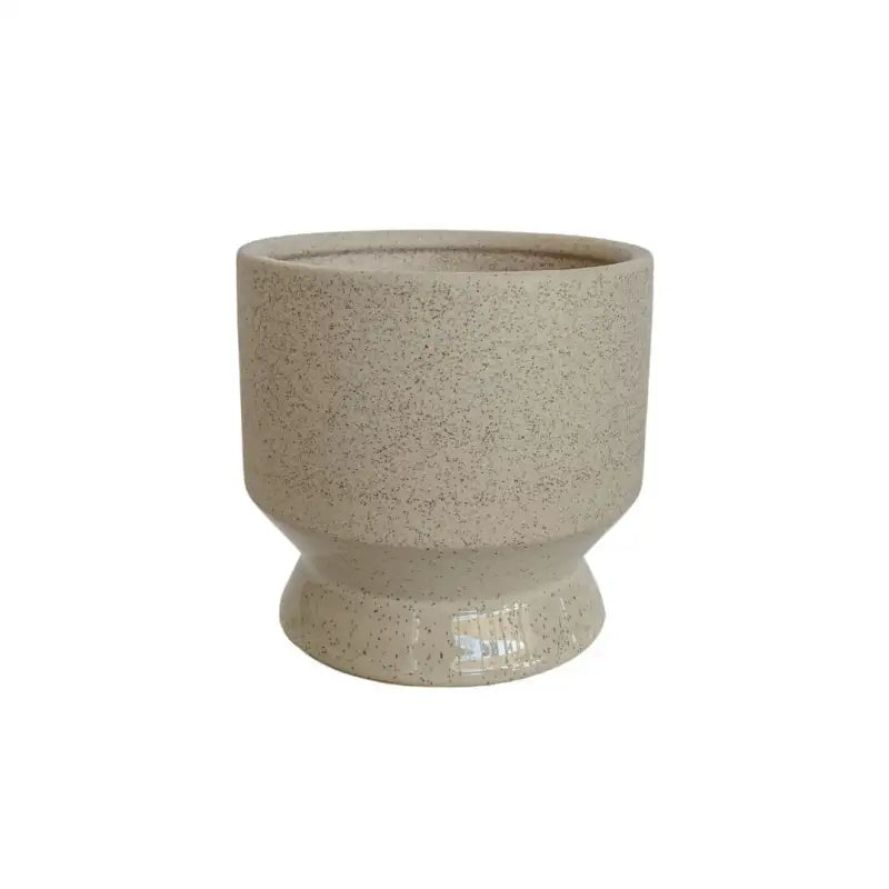 Beige ceramic planter on a white background