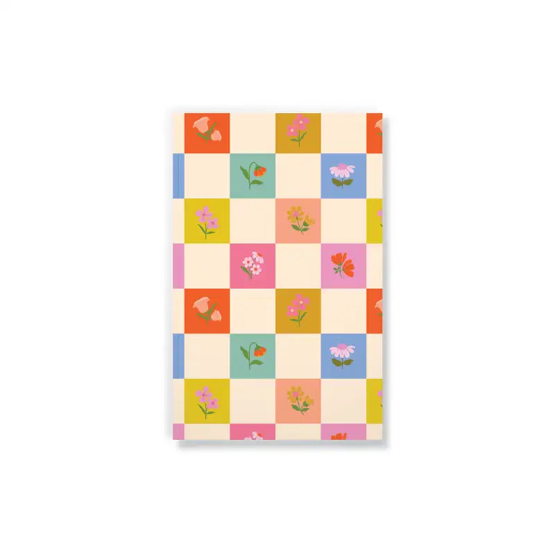 Notebook with a checkered pattern featuring small floral designs on a white background