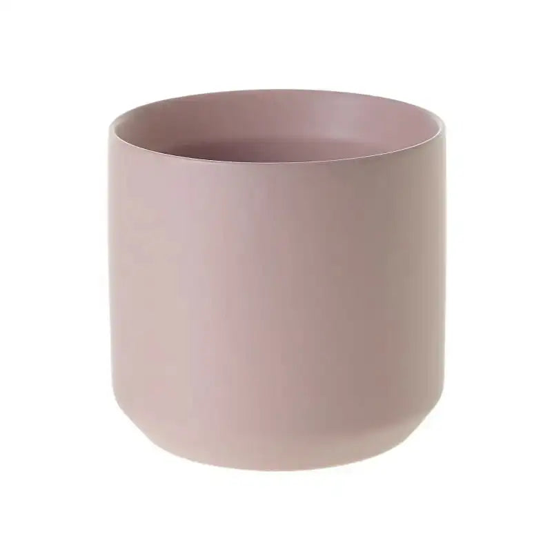 Pink cylindrical pot on a white background