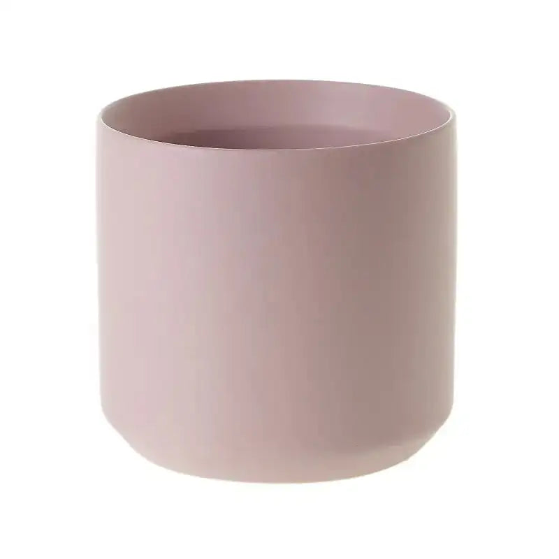 Pink ceramic pot on a white background