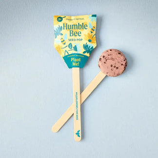Humble Bee seed pop packaging with a pink cookie-like treat on a light blue background