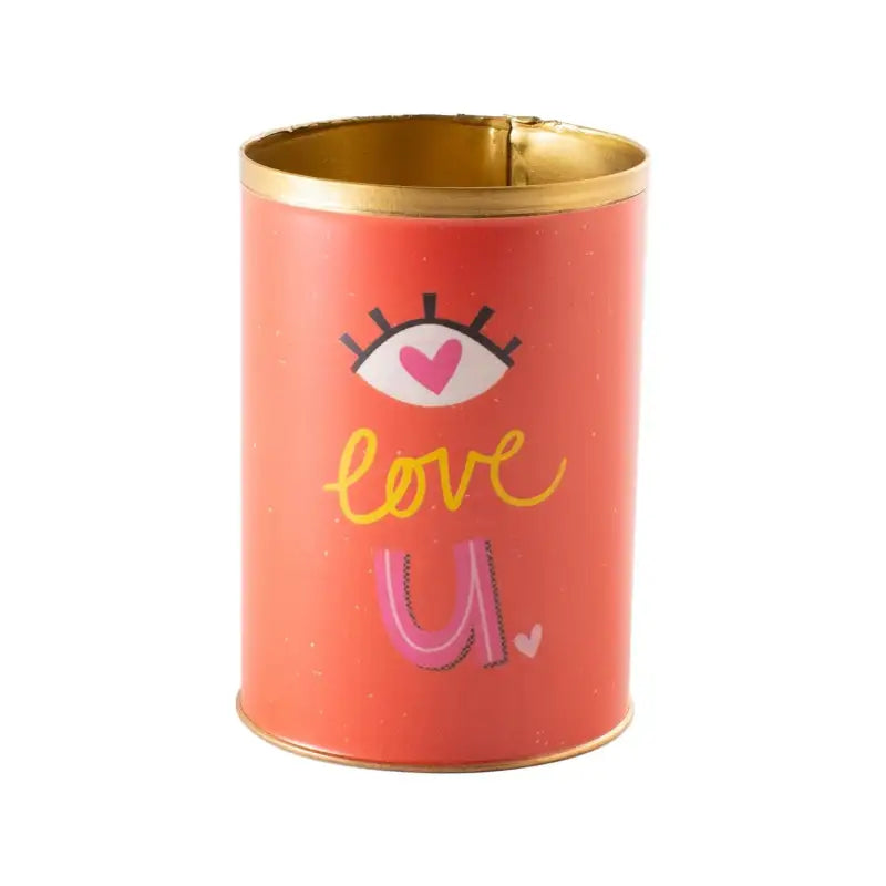 Red cylindrical container with gold lid featuring an eye with a heart, 'love u' text, and hearts on a white background. Punny Can | Pots & Planters - Lizzie Bee's Flower Shoppe