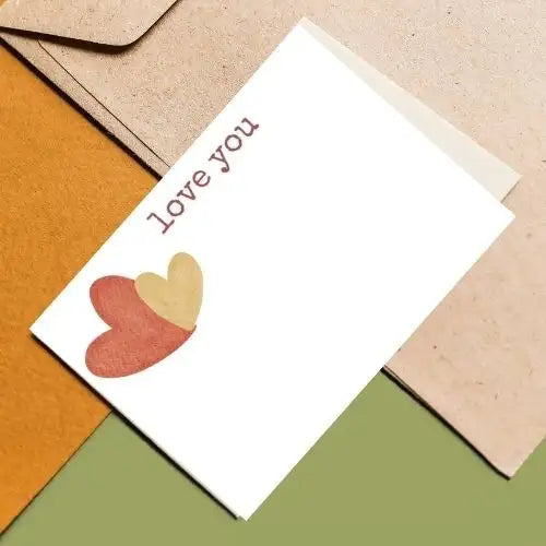 Greeting card with 'love you' text and heart design on a colorful background