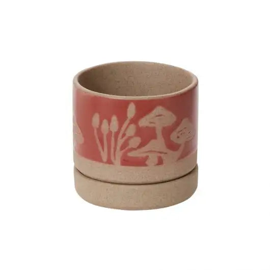 Ceramic container with floral design on a white background