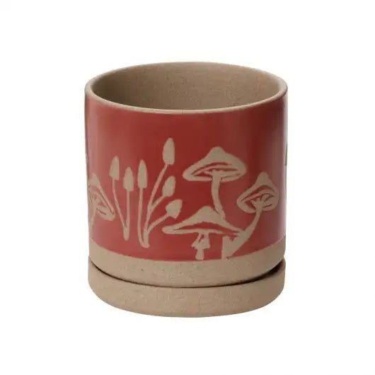 Ceramic cup with red design on a white background