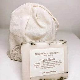 Spearmint and eucalyptus artisian bar soap with a drawstring bag on a white background