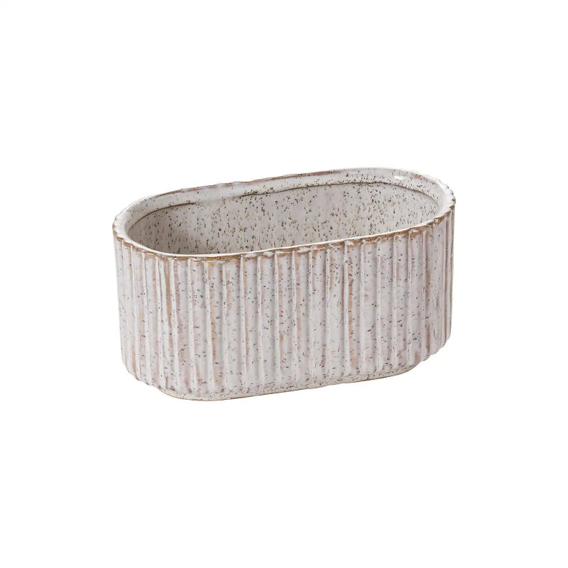 Oval ceramic planter with textured surface on a white background