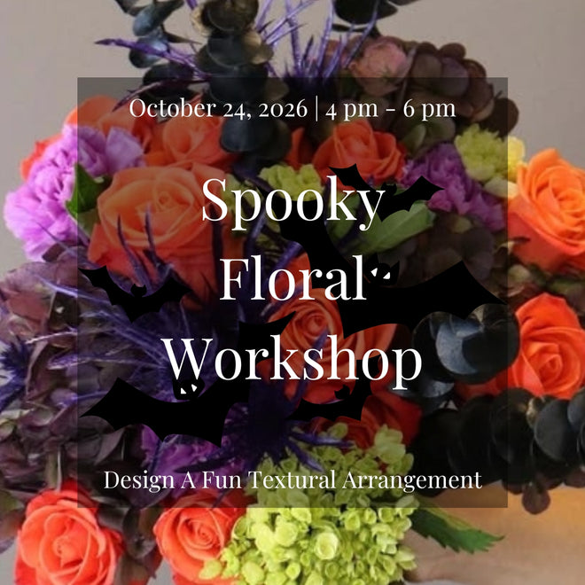 Halloween-inspired floral arrangement featuring bright orange flowers, lime green blooms, and purple accents created during the Spooky Floral Workshop at Lizzie Bee's Flower Shoppe in Richardson, Texas.