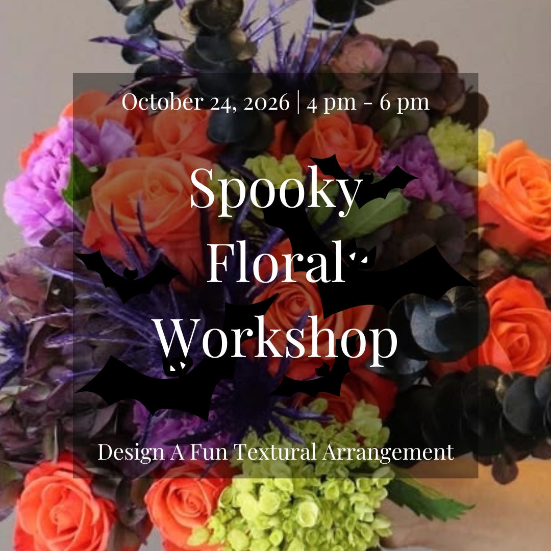 Halloween-inspired floral arrangement featuring bright orange flowers, lime green blooms, and purple accents created during the Spooky Floral Workshop at Lizzie Bee's Flower Shoppe in Richardson, Texas.