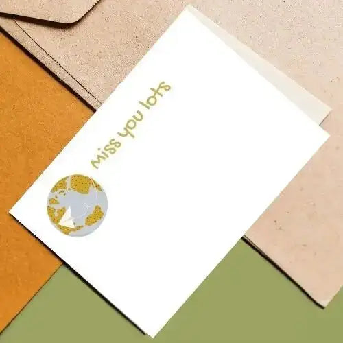 Greeting card with 'Miss you lots' text and star design on a colorful background