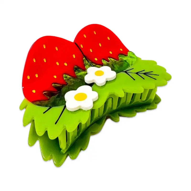 Hair clip with strawberry and flower design on a white background